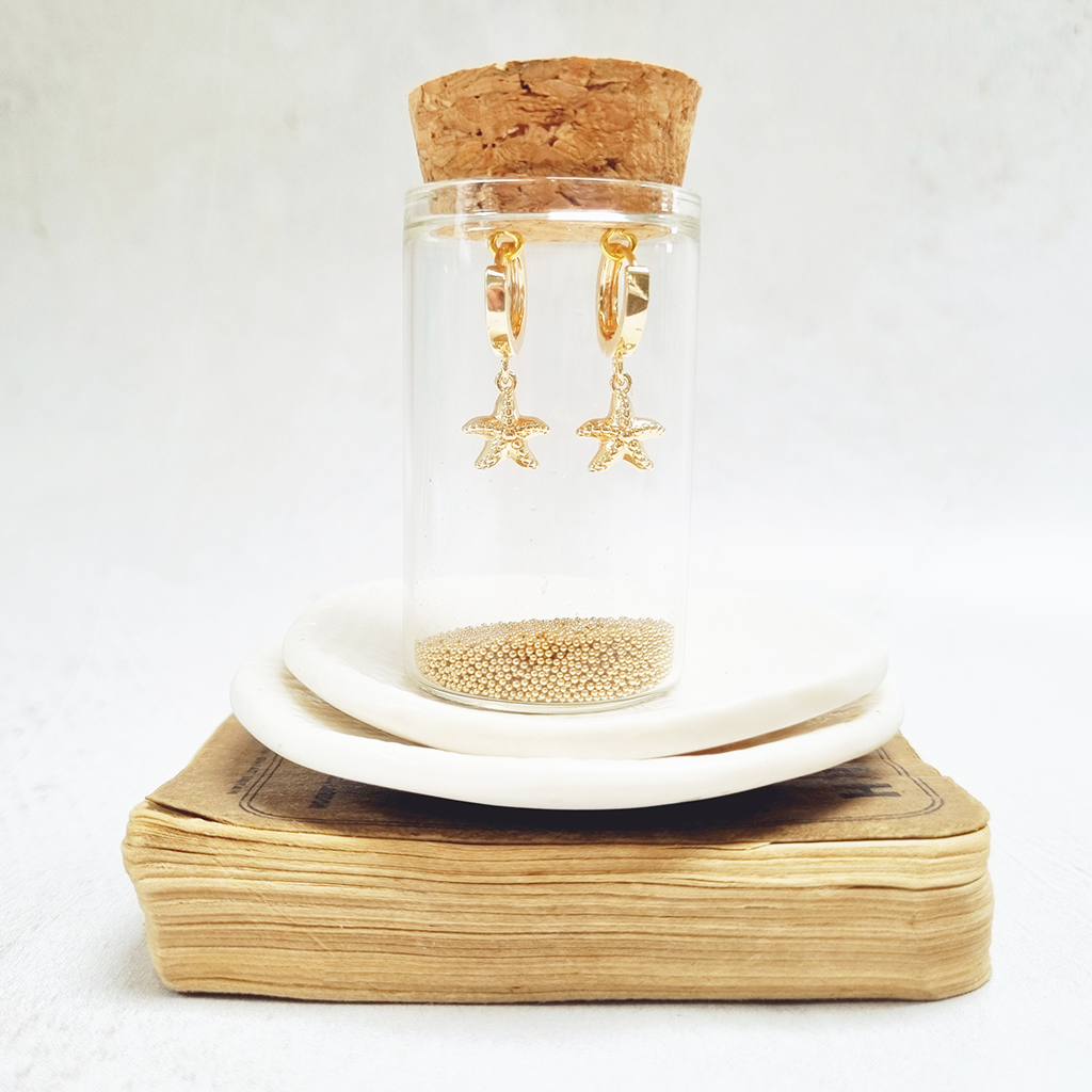 Zamsoe - Gold Starfish Huggie Earrings in a bottle