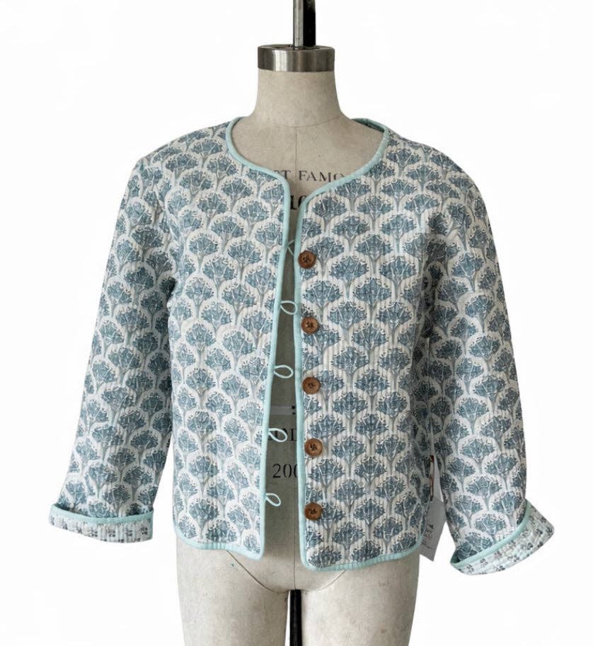 Wood block printed cotton quilted reversible jacket in soft blues.