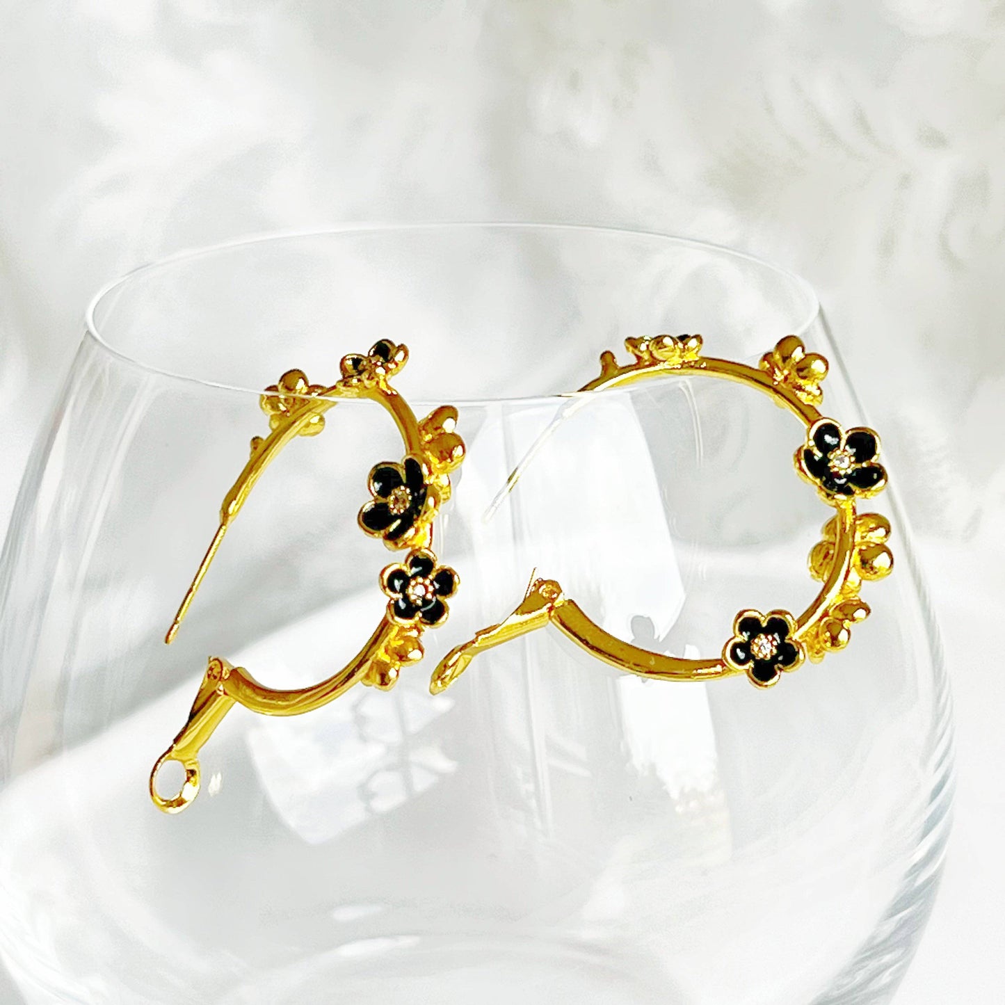 Ninaouity Black Flowers in Gold Hoop Earrings