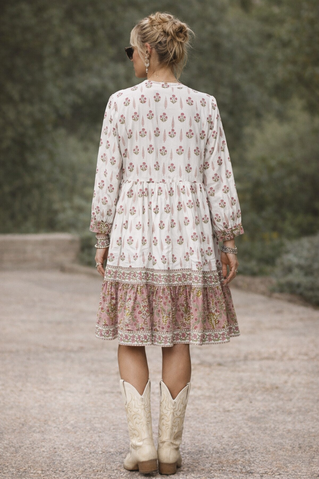Wood block printed cotton voile dress in soft cream and pink .