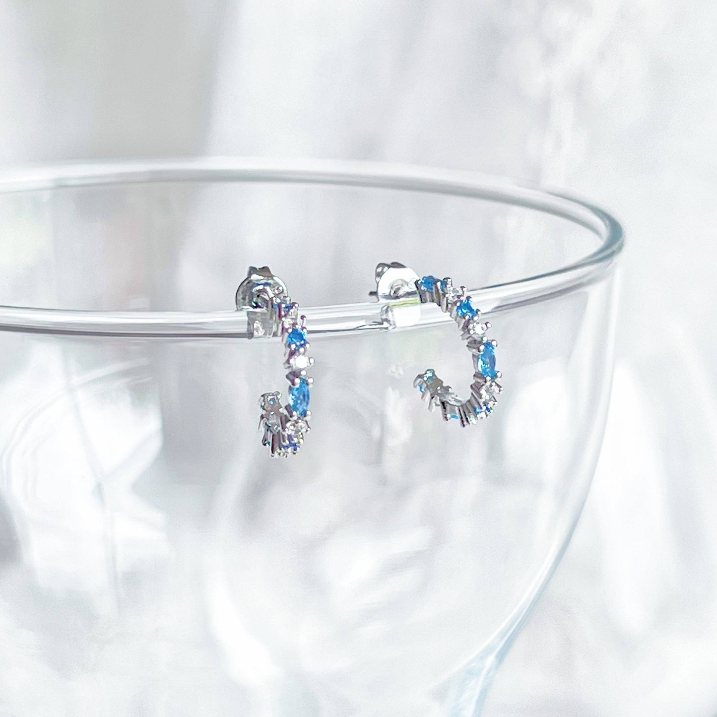 Ninaouity - Silver Blue Topaz Mini Hoop Earrings - December Birthstone