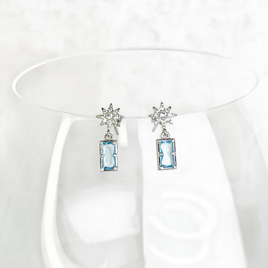 Ninaouity Silver Pole Star and Blue Square Crystal Earrings