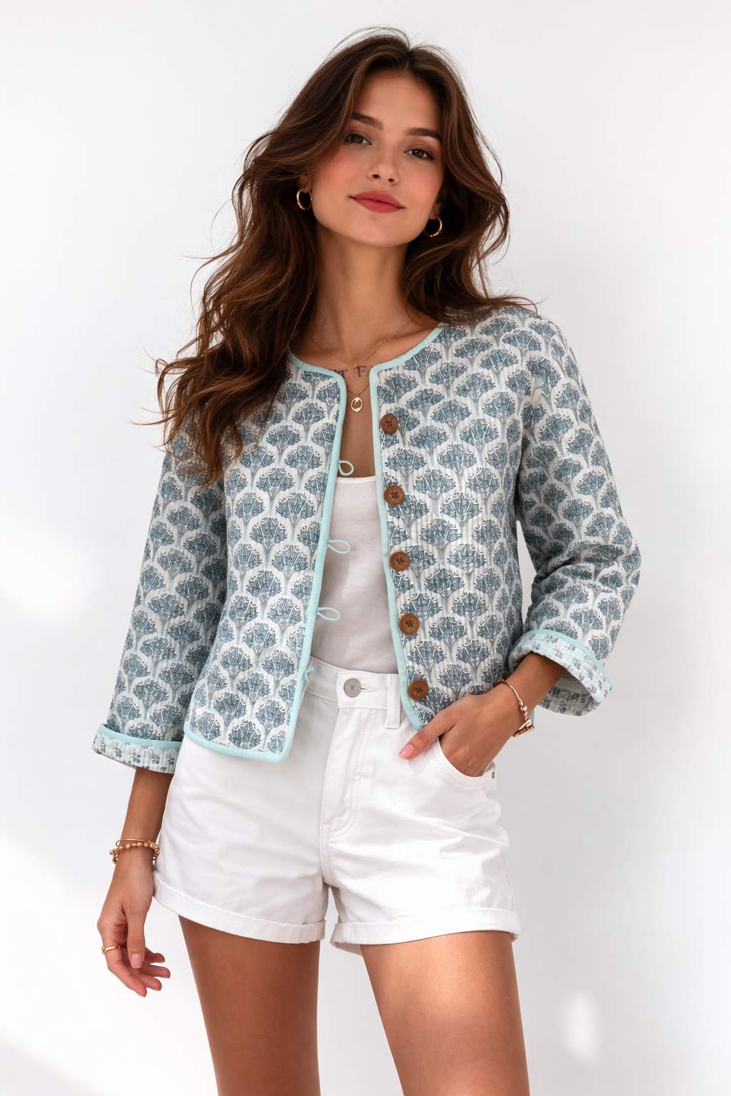 Wood block printed cotton quilted reversible jacket in soft blues.