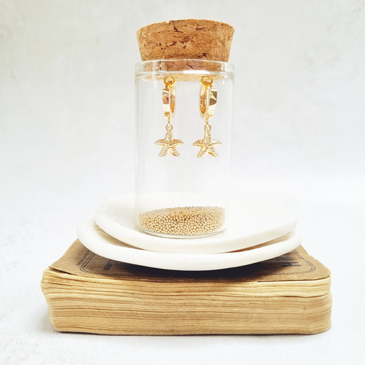 Zamsoe - Gold Starfish Huggie Earrings in a bottle