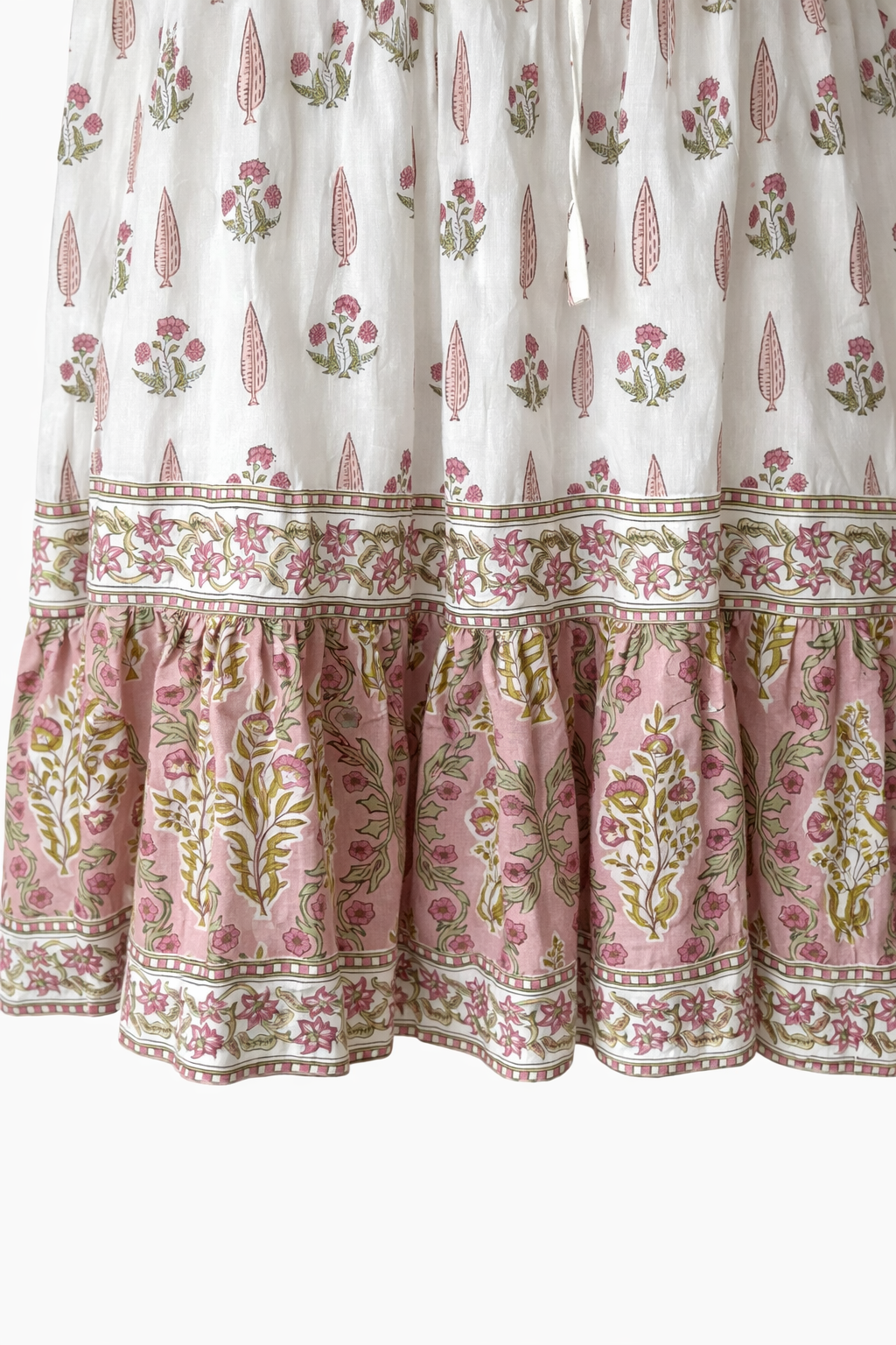 Wood block printed cotton voile dress in soft cream and pink .