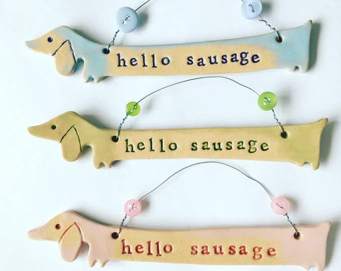 Silly Sausage ceramic dachshund plaque. Made in Wales.