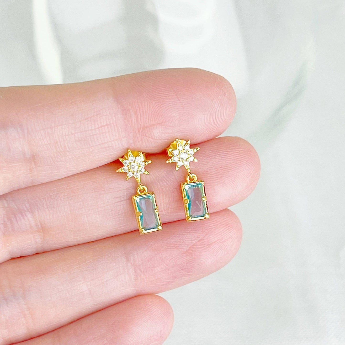 Ninaouity Gold Pole Star and Blue Square Crystal Earrings