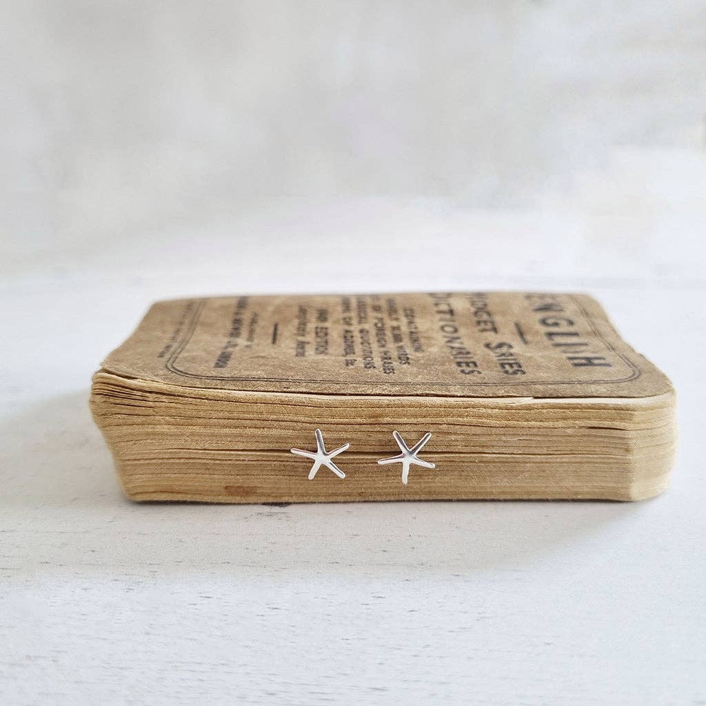 Sterling silver starfish stud earrings in a bottle