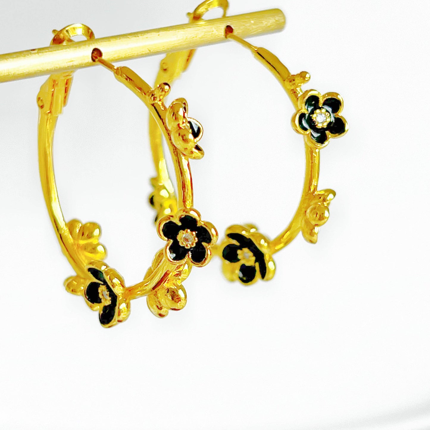 Ninaouity Black Flowers in Gold Hoop Earrings